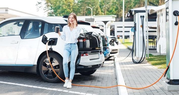 woman charging ev